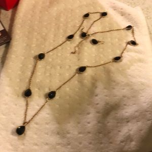 A black necklace with matching earrings 🖤